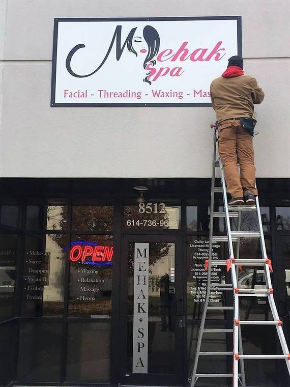 Sign board installation on a building facade
