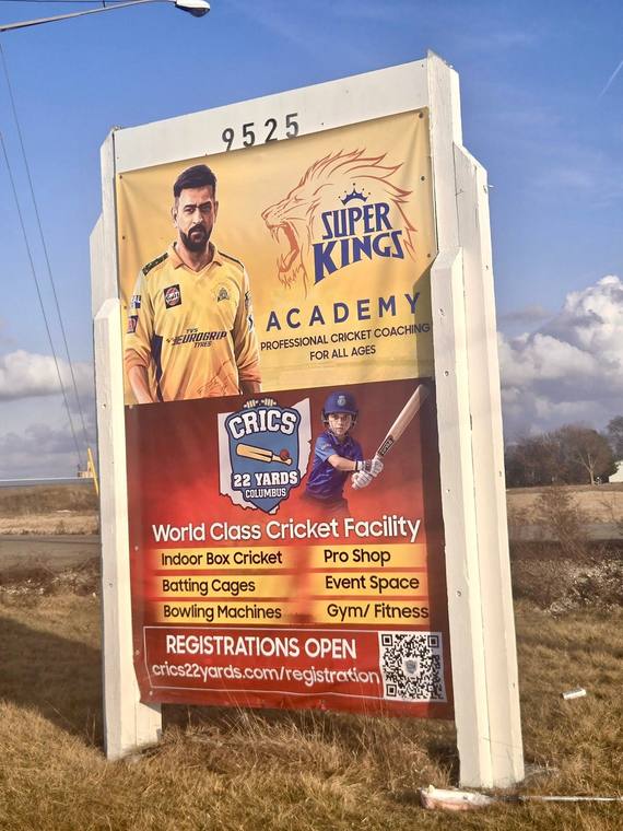 Outdoor billboard sign for a cricket academy